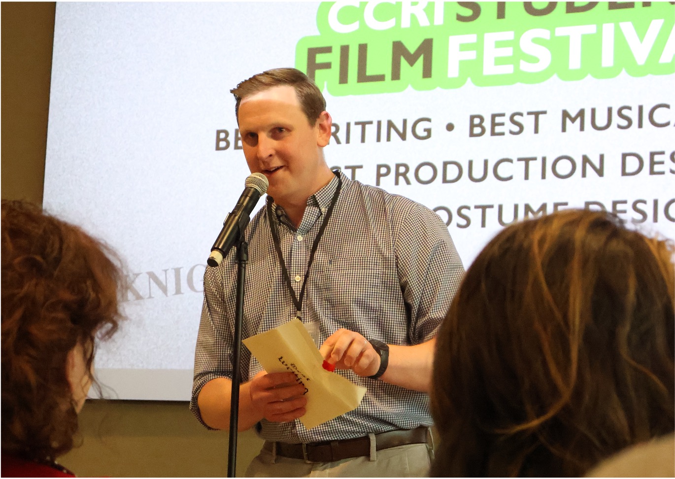 jon talking on a mic